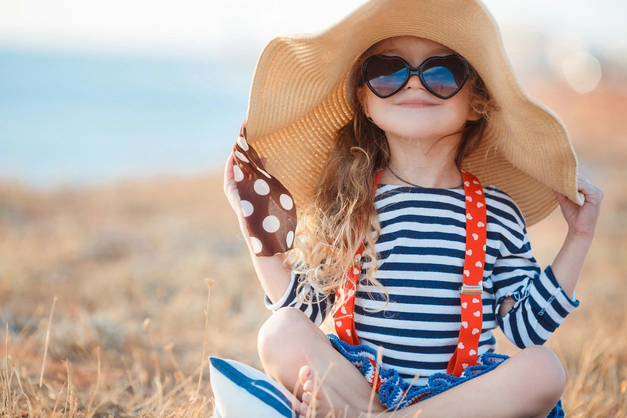 Child in Hats and Sunglasses